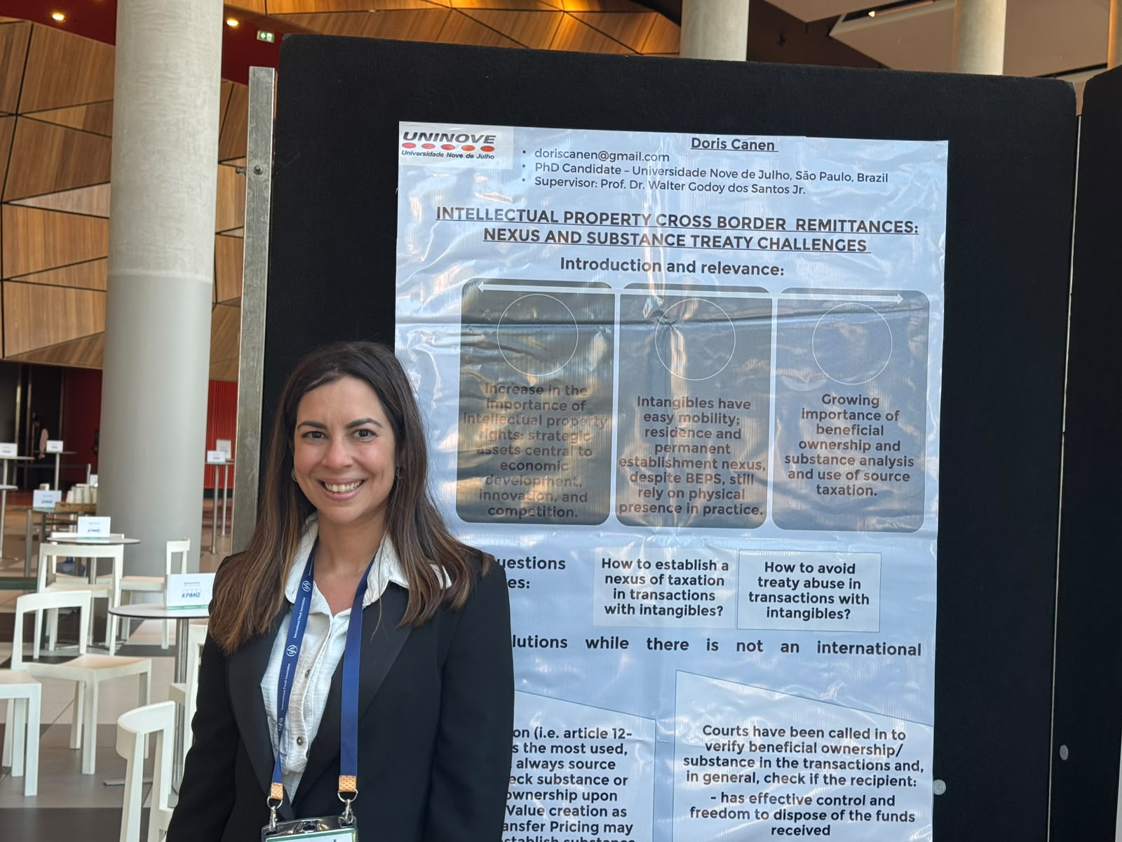 Doris Canen next to her poster selected for the IFA Poster Programme